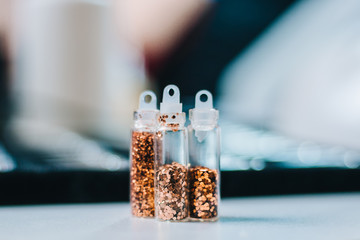Small jars with sequins for manicure yellow. Gold powder