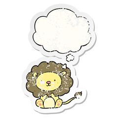cartoon lion and thought bubble as a distressed worn sticker