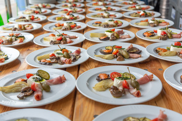 plates with antipasti appetizers