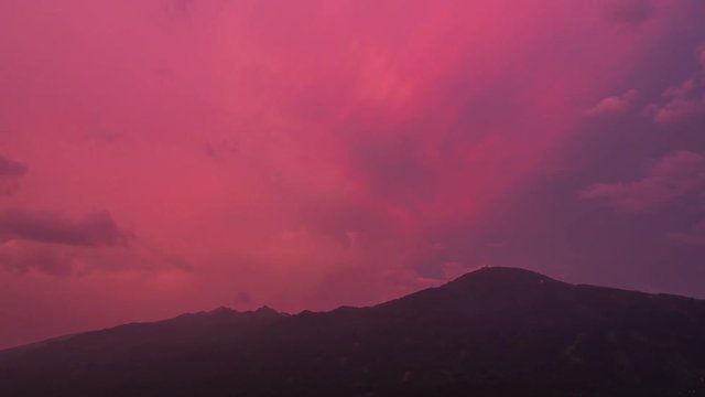 Colorful time-lapse of a thunderstorm coming up over a mountainscape