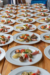 plates with antipasti appetizers