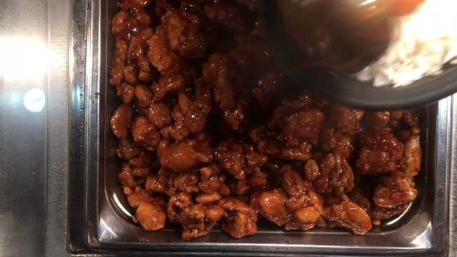 Chinese chicken scooped from bin at restaurant 4k