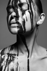 liquid paint over a beautiful face and Body