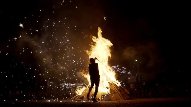 San Joan Night Celebration. Traditional summer fire night in Catalonia, Spain. Fireworks and fiesta. Big fires and fireworks are on the streets. Nightlife.