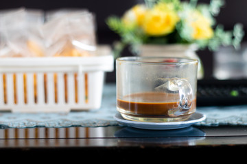 A coffee cup on wooden desk