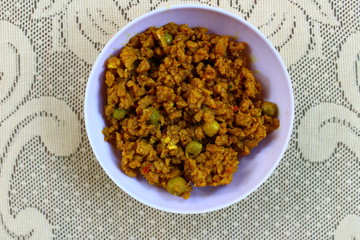 Cooked soya granules in a plastic bowl