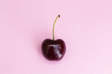 Cherry fruit Isolated on pink background. beautiful pink concept top view