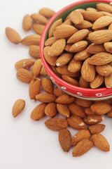 A bowl with almond at white background