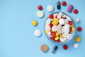 A bowl with colorful medicine pills