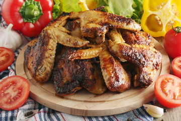 Chicken wings barbecue with different vegetables