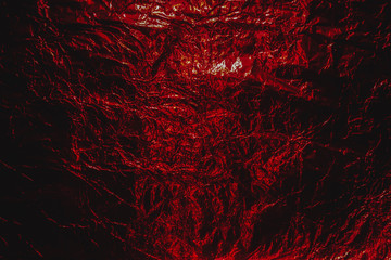 Red hellish grunge abstract crumpled aluminum, Halloween foil background