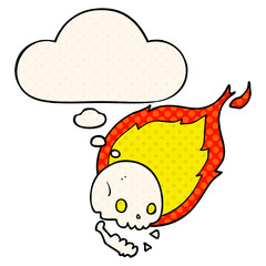 spooky cartoon flaming skull and thought bubble in comic book style