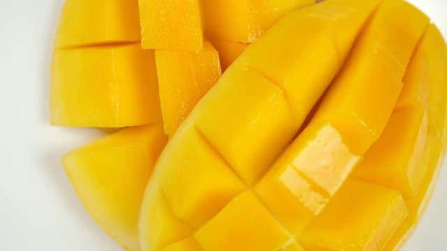 Rotation of fresh Thai yellow mango. Tropical fruit close up.