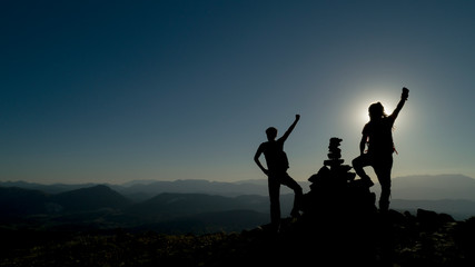 Fototapeta na wymiar powerful climbers reaching the peaks together