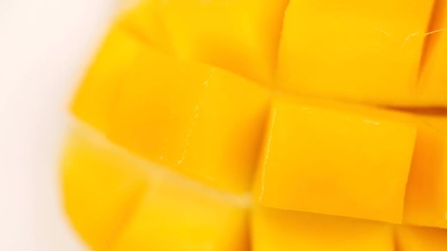 Rotation of fresh Thai yellow mango. Tropical fruit close up.