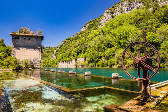The Roman port of ancient Narnia (Narni), in Stifone, in the canyons of the Nera river. The blue sky and the clear, cold and turquoise water, on a sunny day, in the summer. Wild and pristine nature.