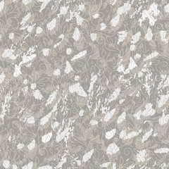 Fototapeta premium Modern ornate vector seamless pattern. Abstract gray spots and doodle contours of flowers and leaves on gray spotted background. Softness curved swirl template for design, textile, wrapping paper.