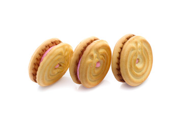 sandwich cookies with strawberry cream on white background