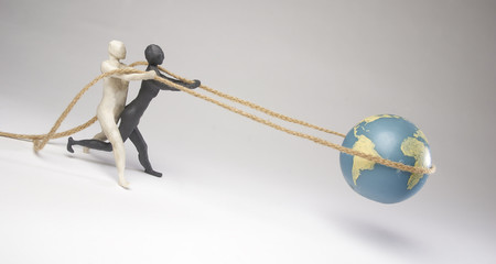With a rope, guys save the planet from falling. Isolated on gray background. With copy text space....