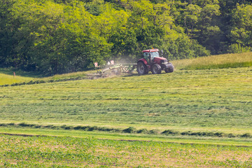 Fototapeta premium modern industrial hay making, summer meadows, agriculture