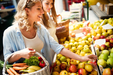 Young woman shopping healthy food on the market