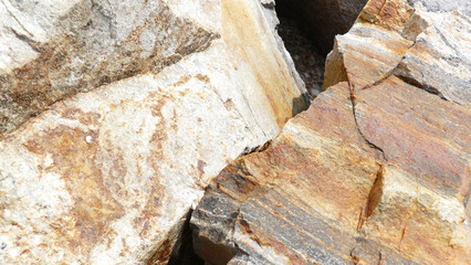Texture of natural stone. Modern background. Image. Design for poster. Abstract backdrop. Black, grey, biege, sepia. Hole on the surface. Patterns and textures of rocks in nature. Closeup detail stone