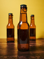  Drink and chips on a wooden table and a yellow background.