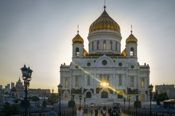 Fototapeta na wymiar The Cathedral of Christ the Savior, illuminated by the evening sun. The sun's rays penetrate through the building