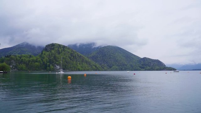 Cloudy day at the mountainous lake. Calming and serene scene.