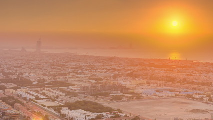 Obraz premium Panorama and aerial view of coastline Dubai at sunset timelapse, United Arab Emirates