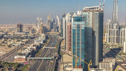 Skyscrapers on Sheikh Zayed Road and DIFC aerial timelapse in Dubai, UAE.