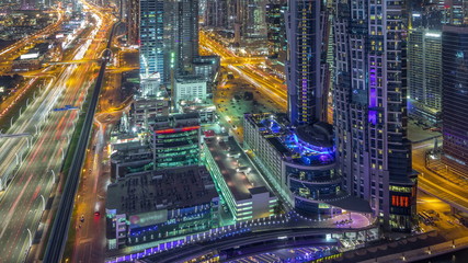 Aerial view to traffic on Sheikh Zayed road and skyscrapers on Dubai downtown night timelapse, Dubai, United Arab Emirates