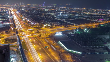 Fototapeta na wymiar Aerial view to traffic on Sheikh Zayed road and intersection night timelapse, Dubai, United Arab Emirates