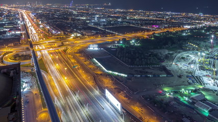 Fototapeta na wymiar Aerial view to traffic on Sheikh Zayed road and intersection night timelapse, Dubai, United Arab Emirates