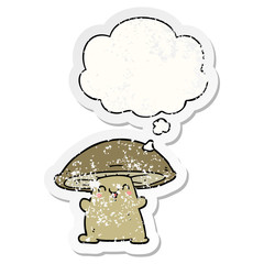 cartoon mushroom character and thought bubble as a distressed worn sticker