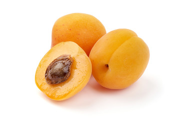 Naklejka na ściany i meble Fresh apricot fruits with juicy half, ripe nectarines, close-up, isolated on white background