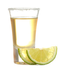 Gold tequila in a glass with salt and lime on a white isolated background. alcoholic beverages. close-up.