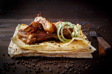 Grill dishes for the restaurant menu. Wooden background. Fried or grilled lamb ribs