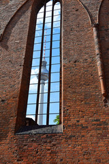 View of the Berlin TV Tower through window of the church