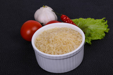 Raw uncooked rice in the bowl
