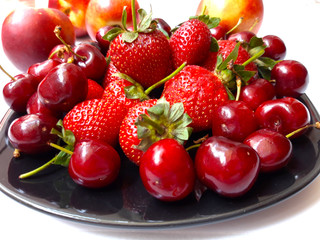 bowl of fresh cherries and strawberries