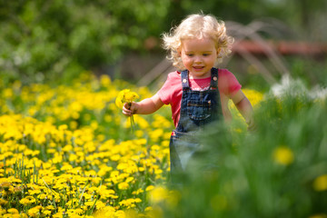 girl walking in a clearing among the flowers