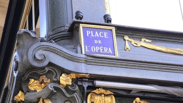 Close up of the Place de l'Opera sign near the Opera Garnier in Paris France on a summer day 