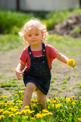 girl walking in a clearing among the flowers