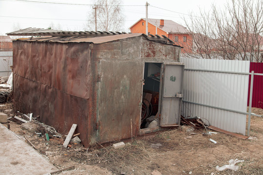 Old rusty metal garage in the city