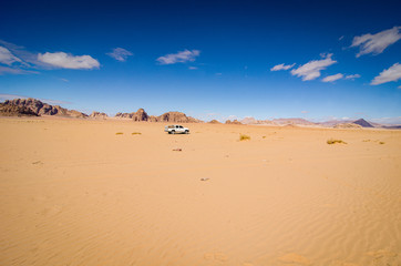 Desert with sandstone and granite rock in shape of boat in Wadi Rum in Jordan