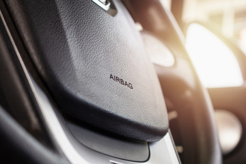 Safety airbag sign on car steering wheel - obrazy, fototapety, plakaty