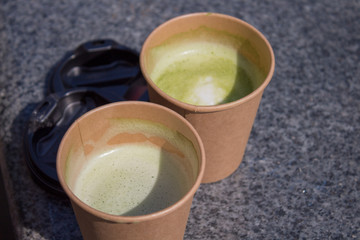  two cups with green drink, matches