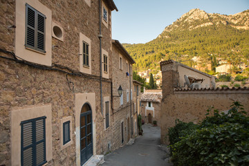 Beautiful view of old mountain village Deia in Mallorca on a sunny day. Deia traditional stone village in Majorca Tramuntana mountain