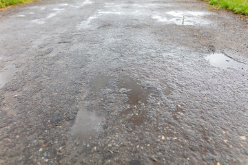 Wet asphalt on the road as an abstract background